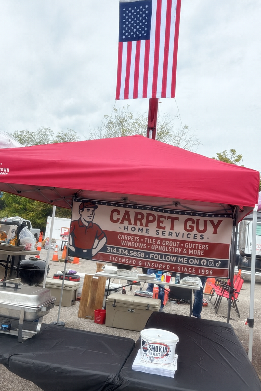 Carpet Guy Home Services charity booth and banner