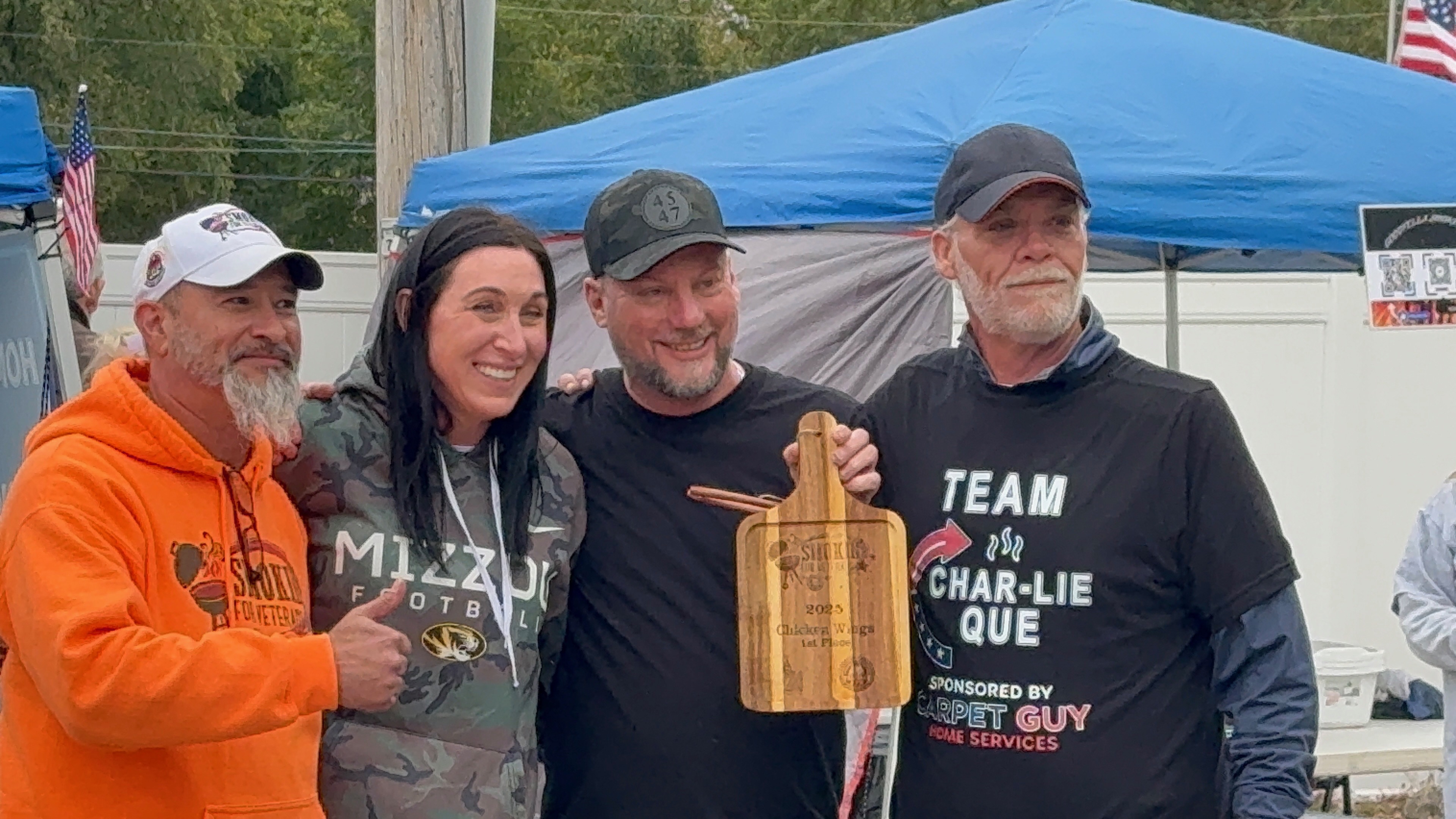 Team accepting award at a veterans charity cookoff